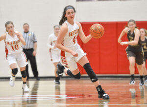 A much different University girls' team looks to hit the ground running when regular season tips off